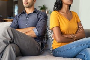 Image of a couple facing away from each other. Marriage counseling and couples therapy can help close this divide. A San Diego couples therapist can help you mend the struggles in your relationship that lead to distance.