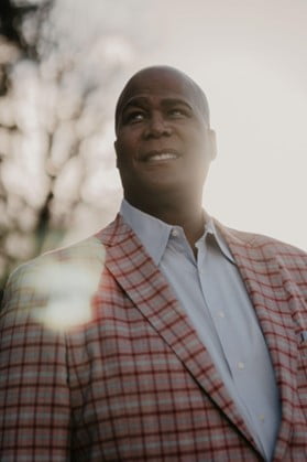 Image of a man in a red plaid suit smiling. Representing the benefits that come after you start healing from addiction. Alcohol counseling and additicitons counseling in San Diego, CA can get you on the road to recovery.,