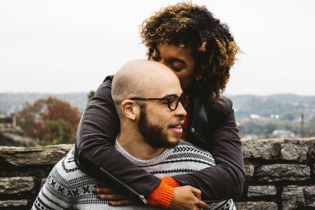 An interracial couple embracing each other, demonstrating the theme of the blog, which explores common obstacles to turning toward your partner and offers solutions for strengthening relationships in California