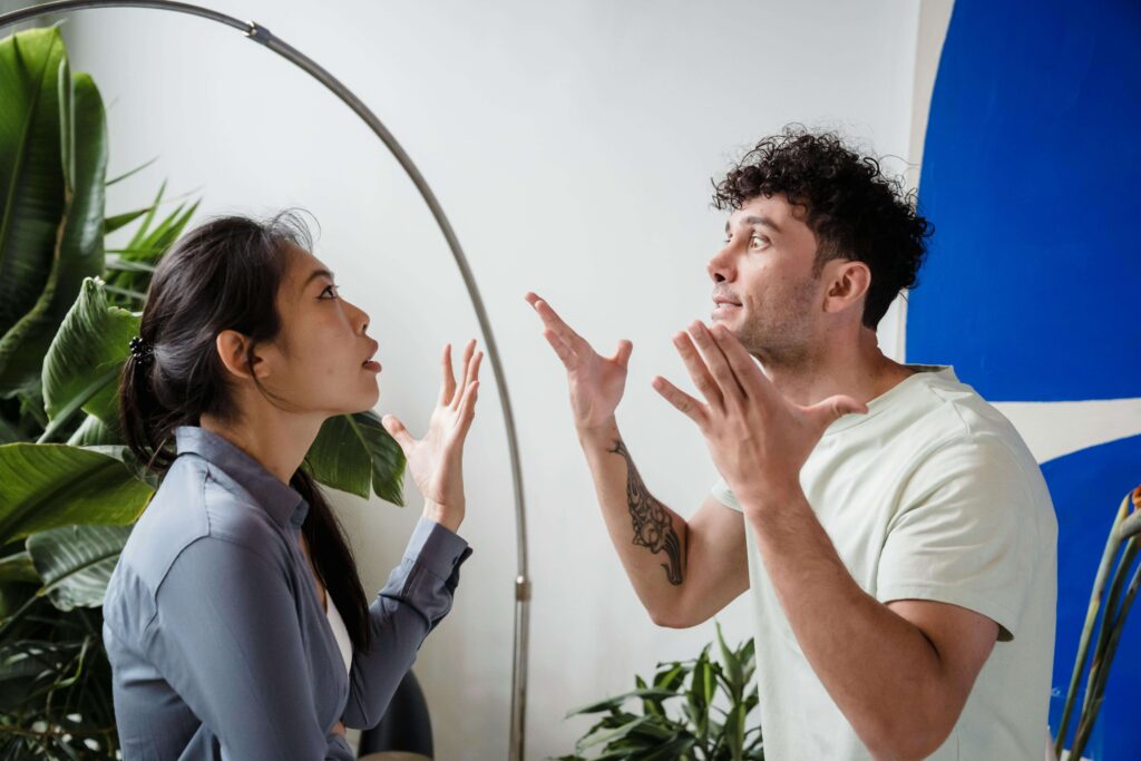 Couple arguing during a disagreement, illustrating emotional dynamics addressed in San Diego couples therapy.