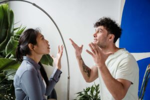 Couple arguing during a disagreement, illustrating emotional dynamics addressed in San Diego couples therapy.