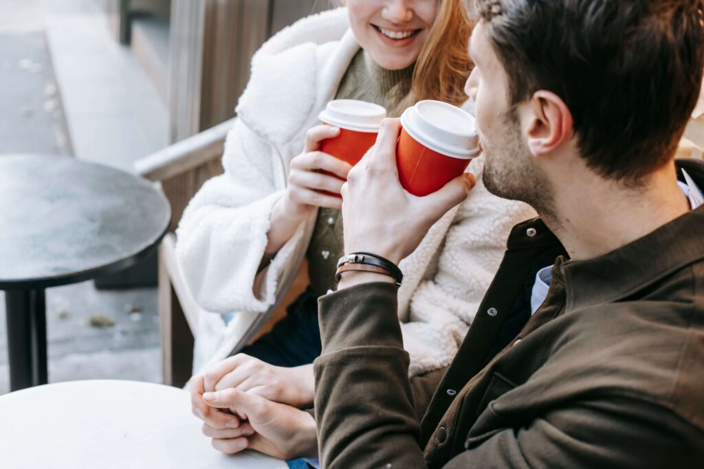 Connection and Ease - couples therapy for adhd san diego ca - couples therapist san diego ca - couples therapy san diego ca - mission valley - la - san francisco - california Happy couple smiling closely while drinking coffee, symbolizing warmth and reconnection supported through couples therapy for ADHD in San Diego, CA.