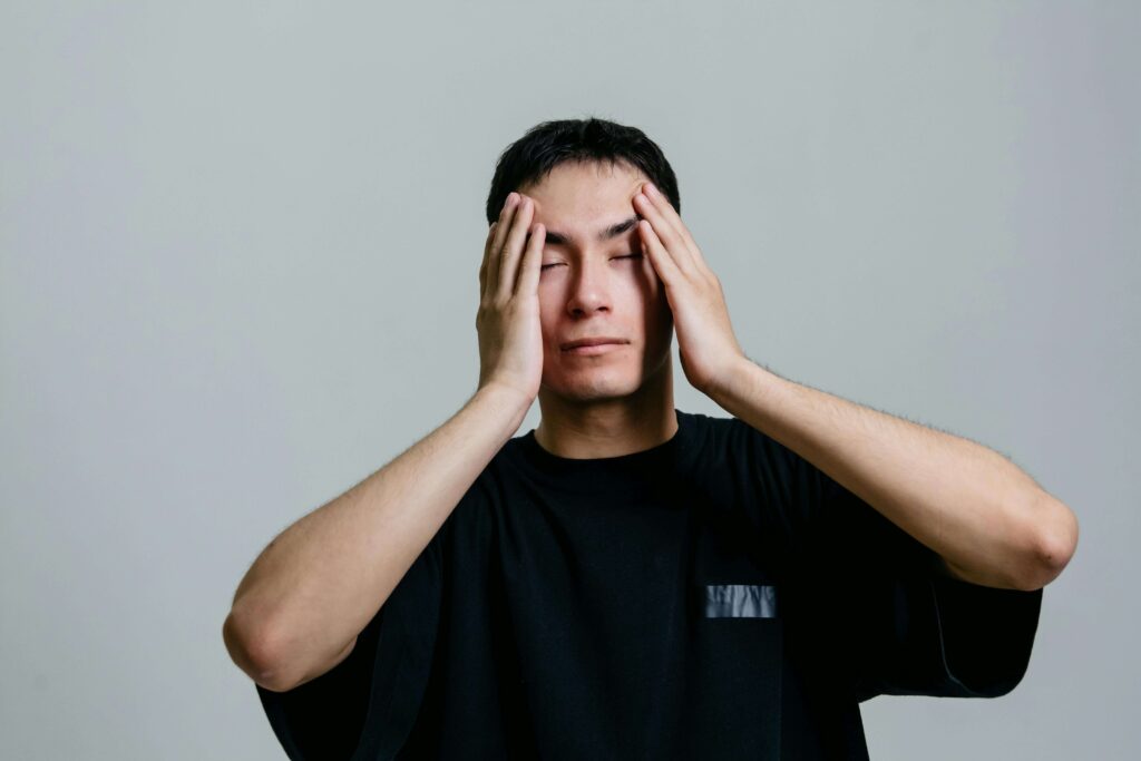 Cognitive Load - couples therapy for adhd san diego ca - couples therapist san diego ca - couples therapy san diego ca - mission valley - la - san francisco - california Man with hands on his head appearing forgetful and stressed, illustrating executive functioning struggles explored in couples therapy for ADHD in San Diego, CA.