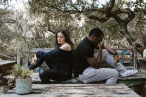 Couple in disagreement, representing emotional reactivity and unresolved patterns explored in trauma-informed couples therapy in San Diego, CA.