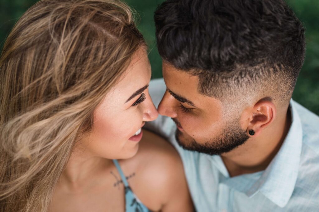 Rebuilding Intimacy - couples therapy san diego ca - couples counseling san diego ca - san diego couples therapy - mission valley - la - san francisco - california Couple with their faces close together smiling, symbolizing renewed connection, understanding, and relationship repair through couples therapy in San Diego, CA.