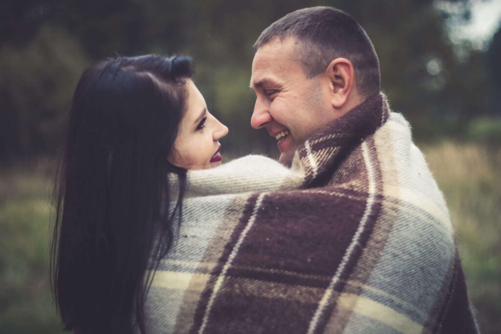 Rebuilding Communication - relationship counseling san diego - san diego couples therapy - relationship therapist san diego - mission valley - la - san francisco - california Happy couple smiling together, symbolizing renewed connection, open communication, and healthier relationship patterns supported through relationship counseling in San Diego, CA.